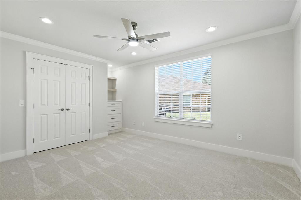 3901 Montecito Drive, Unit 1007 Denton, TX 76210 - Photo 17 of 24 an empty room with fan and windows
