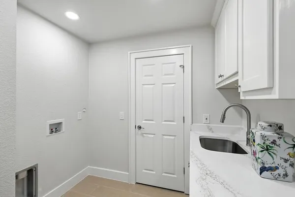 a kitchen with a sink and cabinets