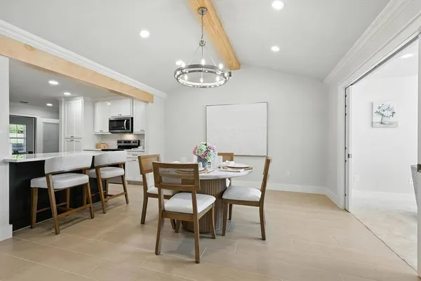 a view of a dining room with furniture