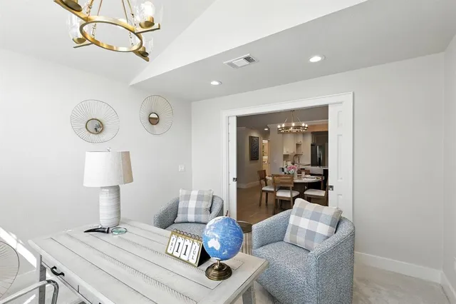 a living room with furniture and a table