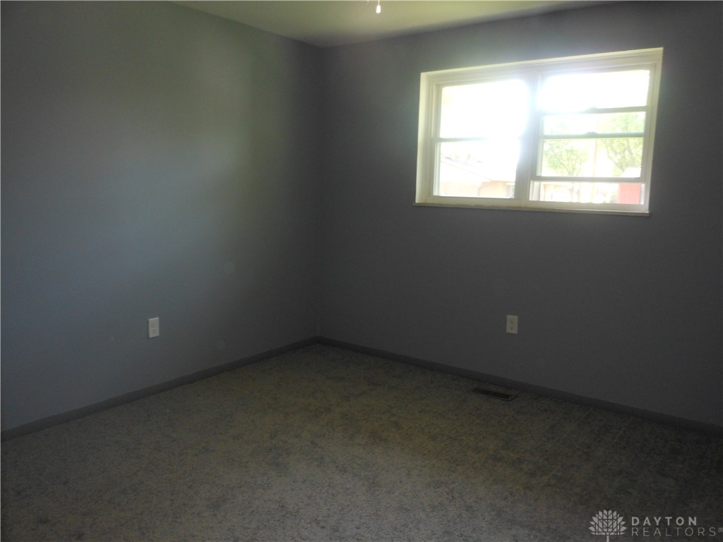 143 West Emerick Road West Milton, OH 45383 - Photo 19 of 37 This spacious room features ample natural light and plush carpeting, ready for your personal touch.