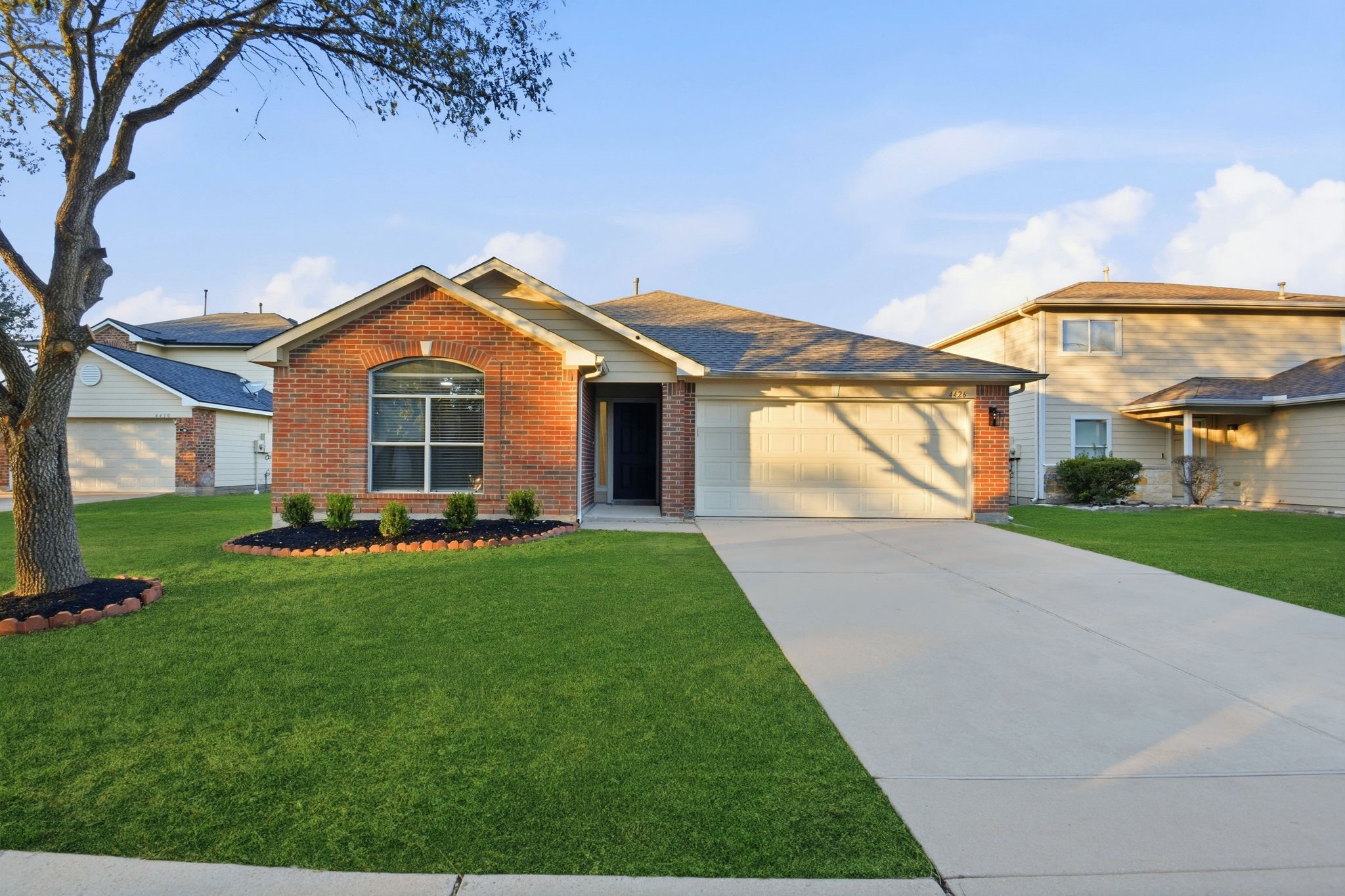 4426 Kulkarni Street Houston, TX 77045 - Photo 2 of 33 a front view of a house with a yard