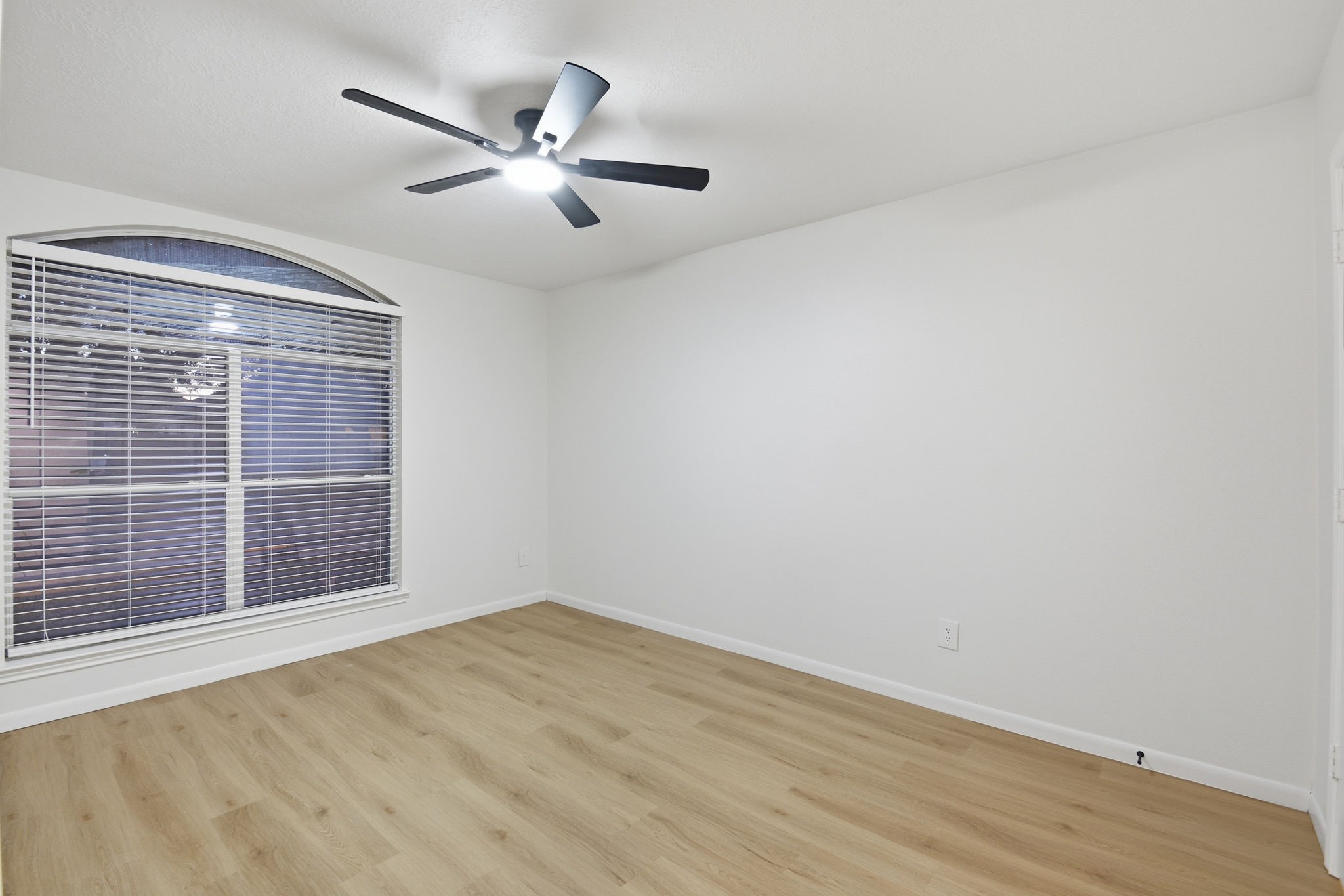 4426 Kulkarni Street Houston, TX 77045 - Photo 27 of 33 wooden floor in an empty room with a window