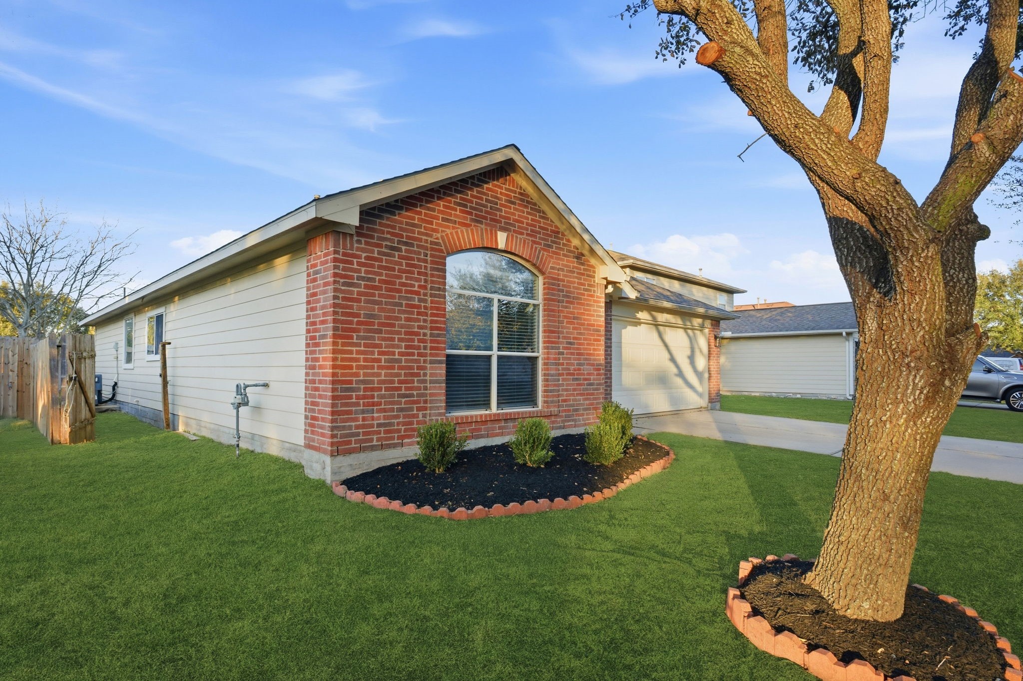 4426 Kulkarni Street Houston, TX 77045 - Photo 3 of 33 a front view of a house with a yard