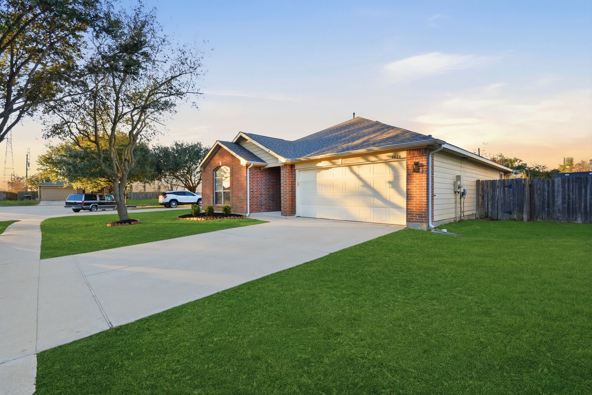 4426 Kulkarni Street Houston, TX 77045 - Photo 4 of 33 a view of a house with a big yard and large tree