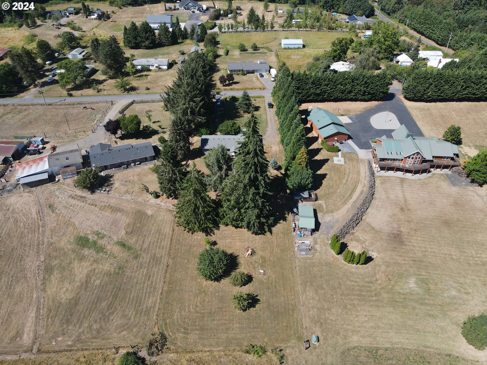1215 Northwest 189th Street Ridgefield, WA 98642 - Photo 8 of 31 an aerial view of a house with a yard and parking spaces