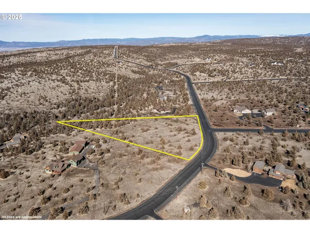 an aerial view of beach and city space