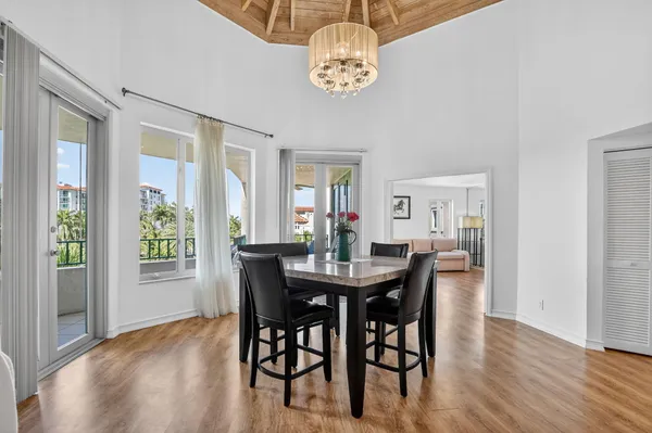 a view of a dining room with furniture and window
