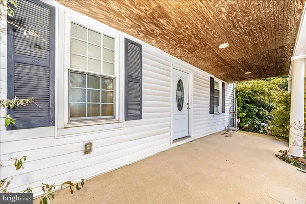 a view of house with large windows