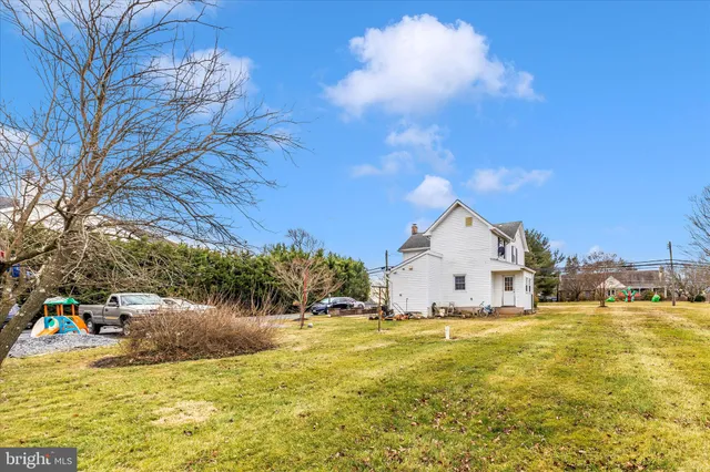 a view of a swimming pool with an outdoor space and seating area
