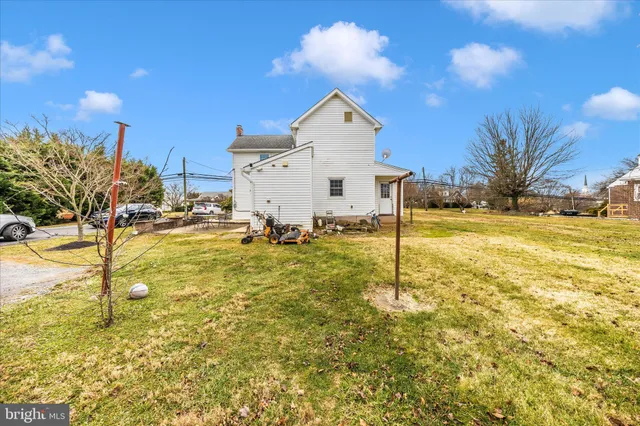 a dining room with stainless steel appliances granite countertop a dining table and chairs