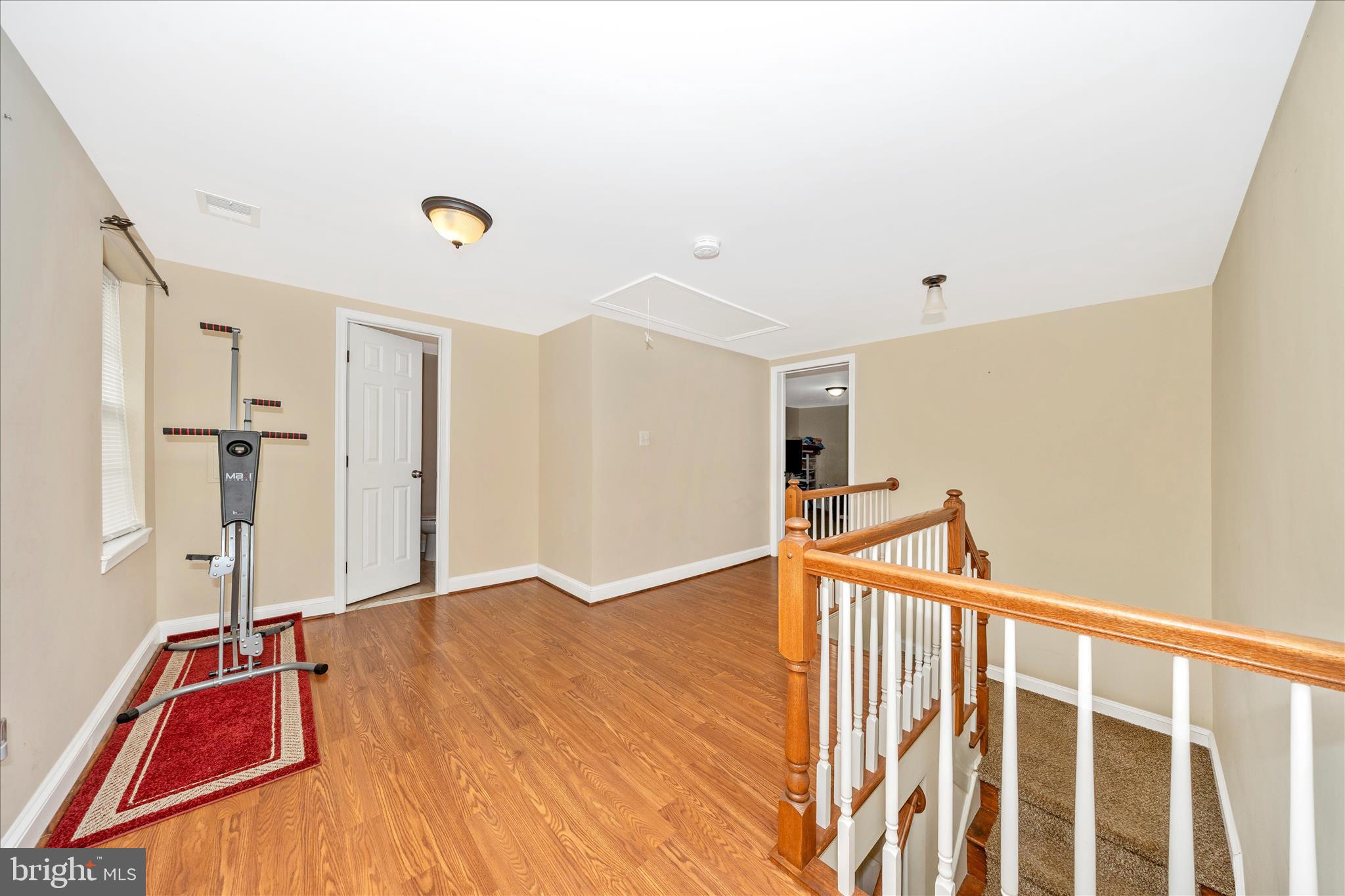 9507 Main Street Damascus, MD 20872 - Photo 38 of 51 a view of an empty room with wooden floor