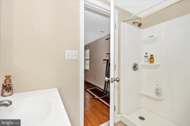a bedroom with furniture and a flat screen tv