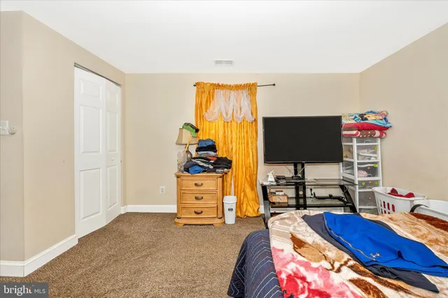 a bathroom with a sink mirror vanity and toilet