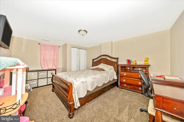 a bedroom with a bed and a small place