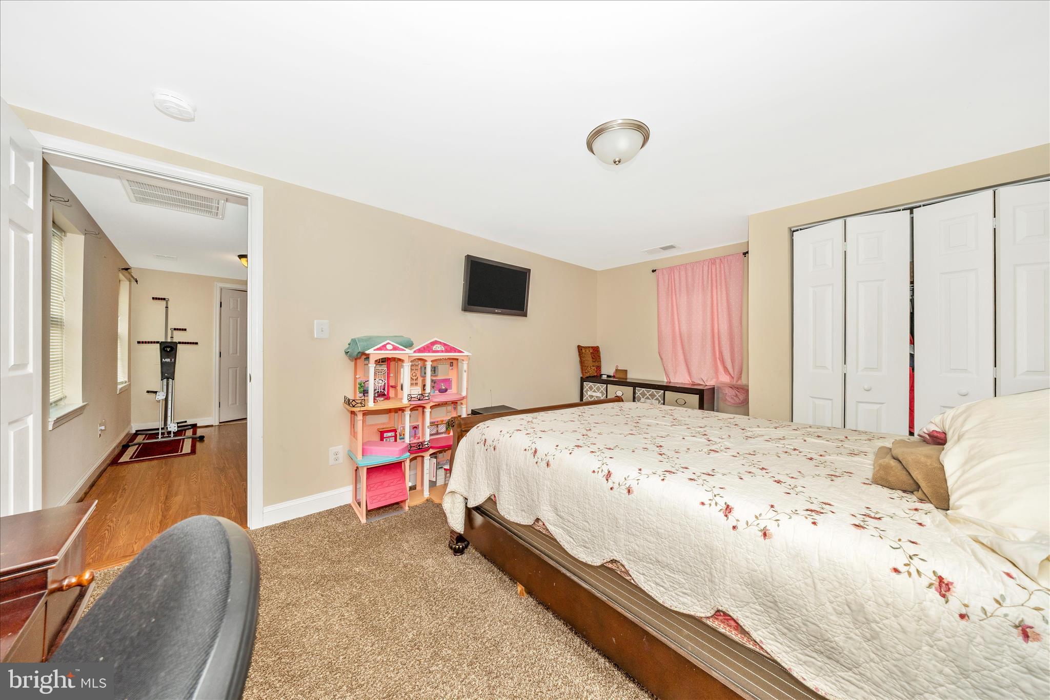 9507 Main Street Damascus, MD 20872 - Photo 51 of 51 a bedroom with a bed and a dresser