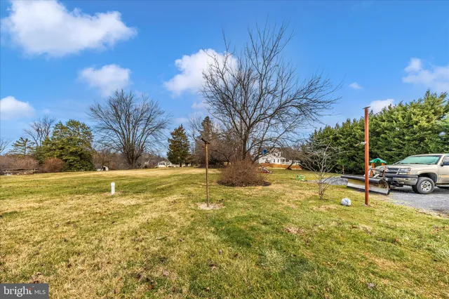 a view of a swimming pool with an outdoor space and seating area