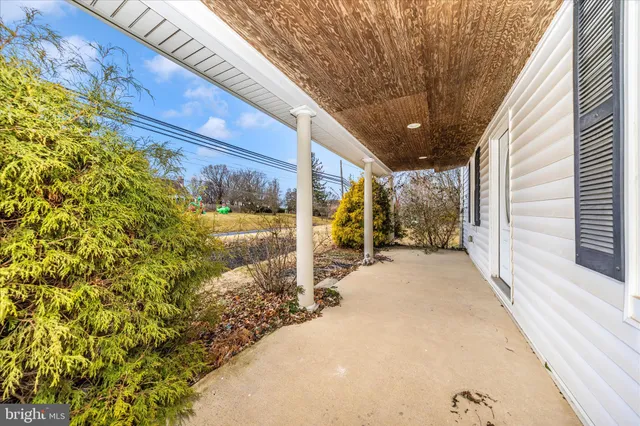 a view of a porch with wooden floor