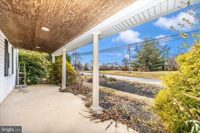 a view of a porch with wooden floor