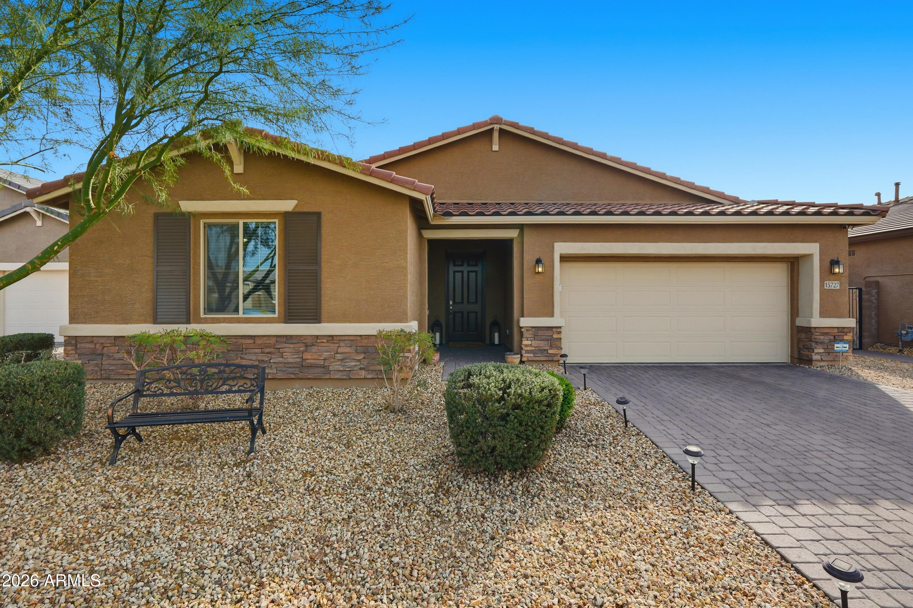 a front view of a house with garden