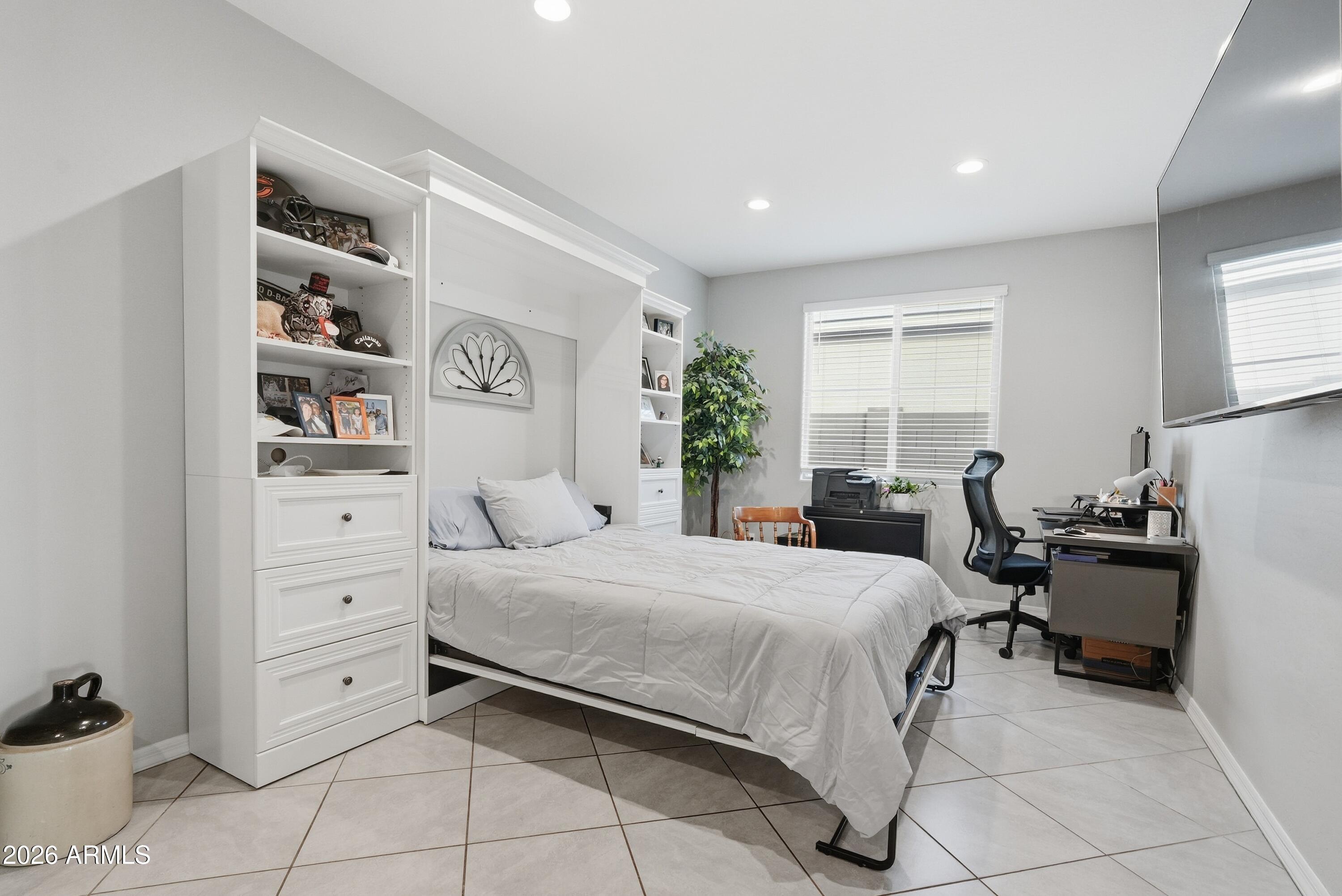 15727 West Madison Street Goodyear, AZ 85338 - Photo 20 of 41 a bedroom with a bed and a dresser