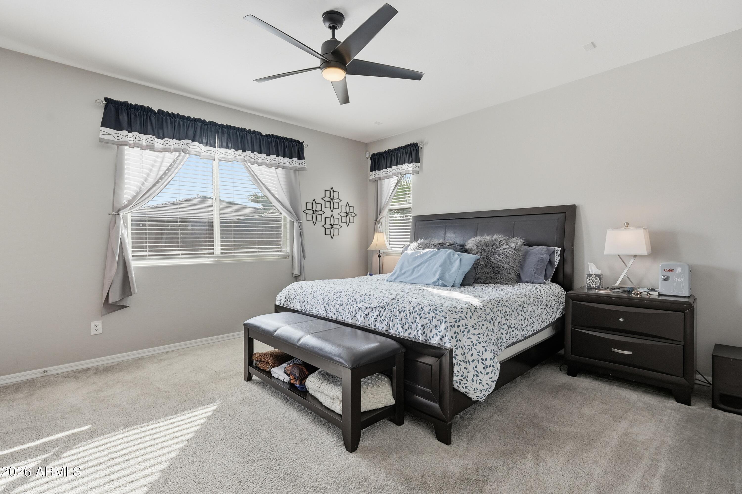 15727 West Madison Street Goodyear, AZ 85338 - Photo 21 of 41 a bedroom with a bed and a window