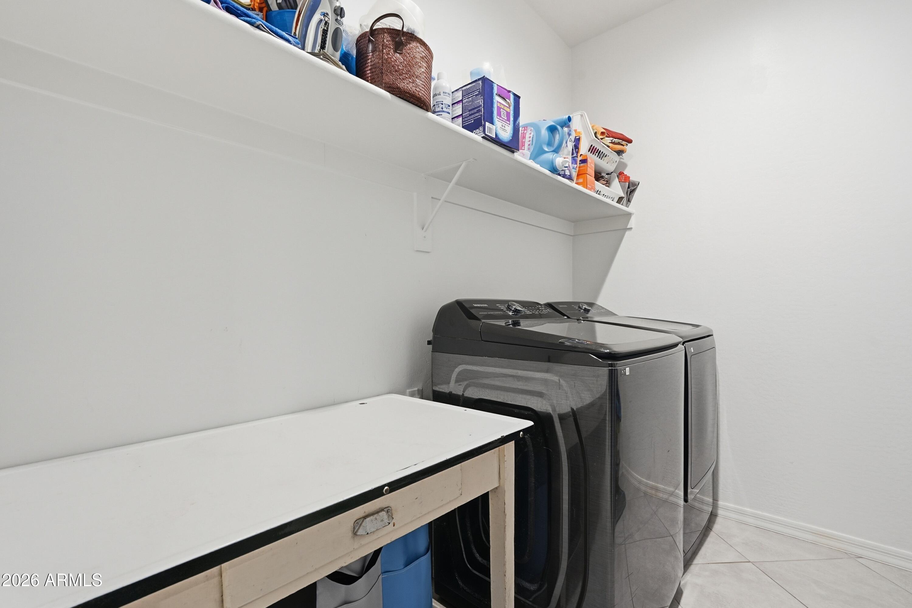 15727 West Madison Street Goodyear, AZ 85338 - Photo 34 of 41 a utility room with dryer and washer