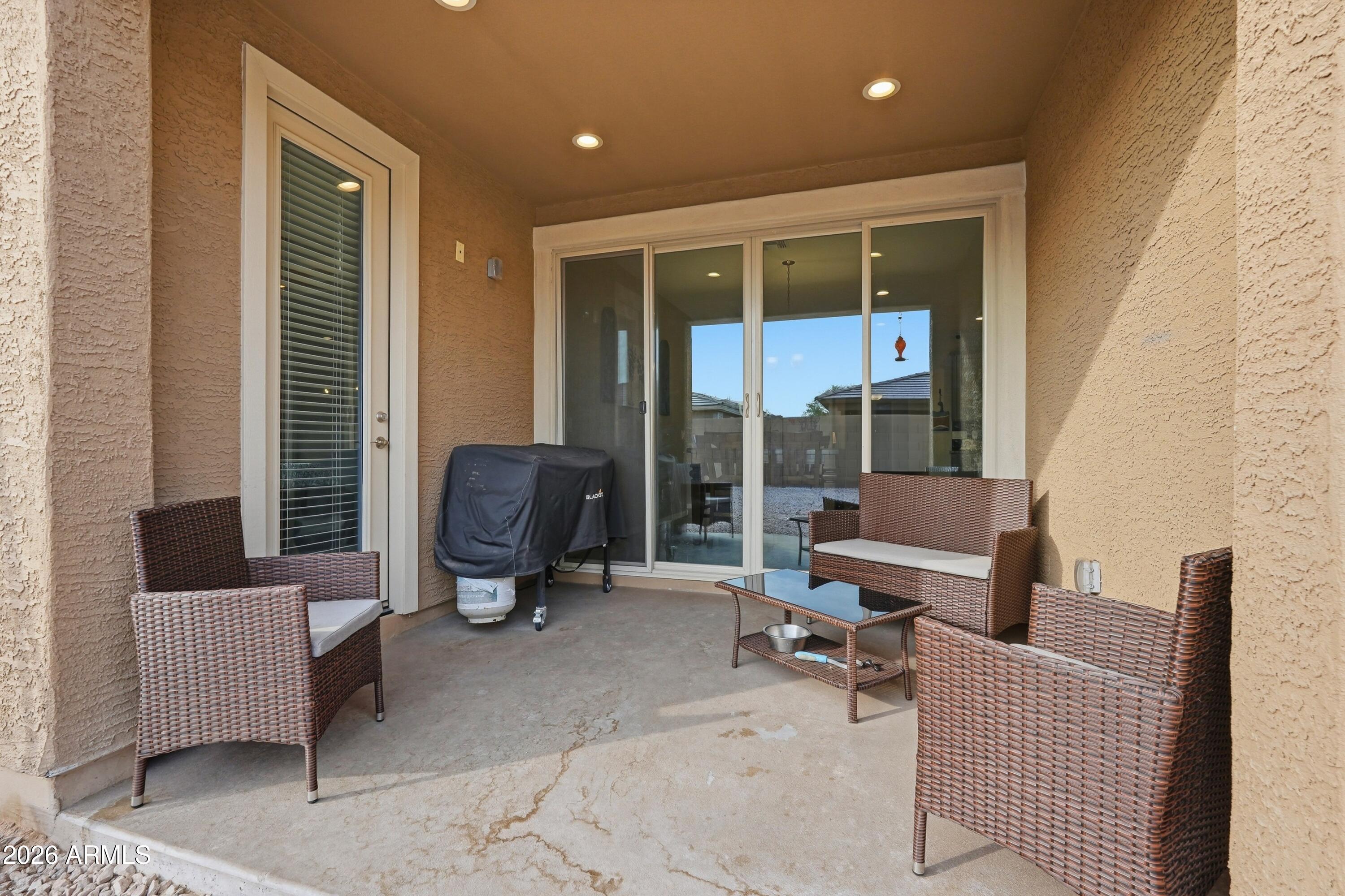 15727 West Madison Street Goodyear, AZ 85338 - Photo 38 of 41 a living room with furniture and a window