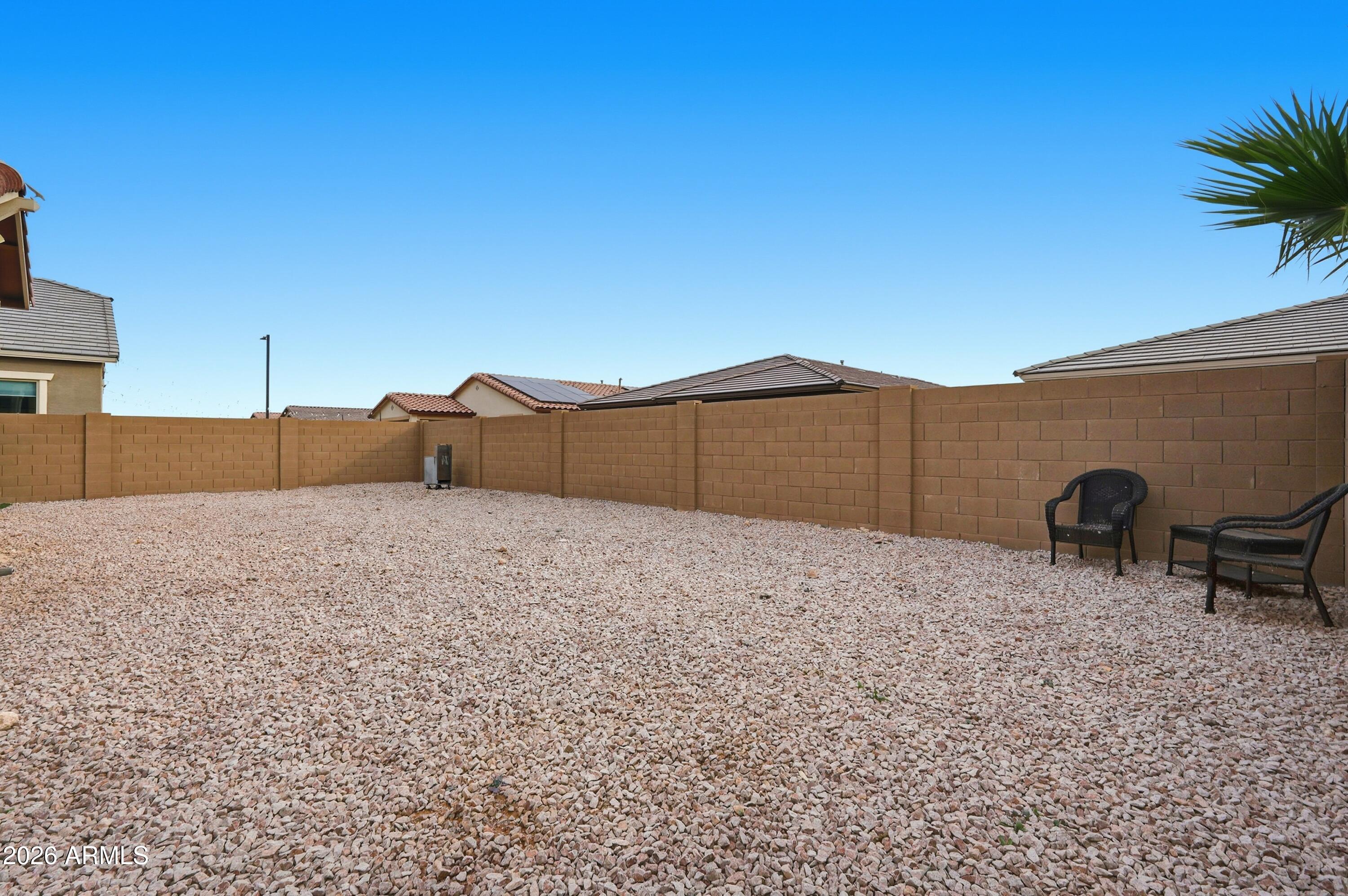 15727 West Madison Street Goodyear, AZ 85338 - Photo 41 of 41 a house view with a backyard space