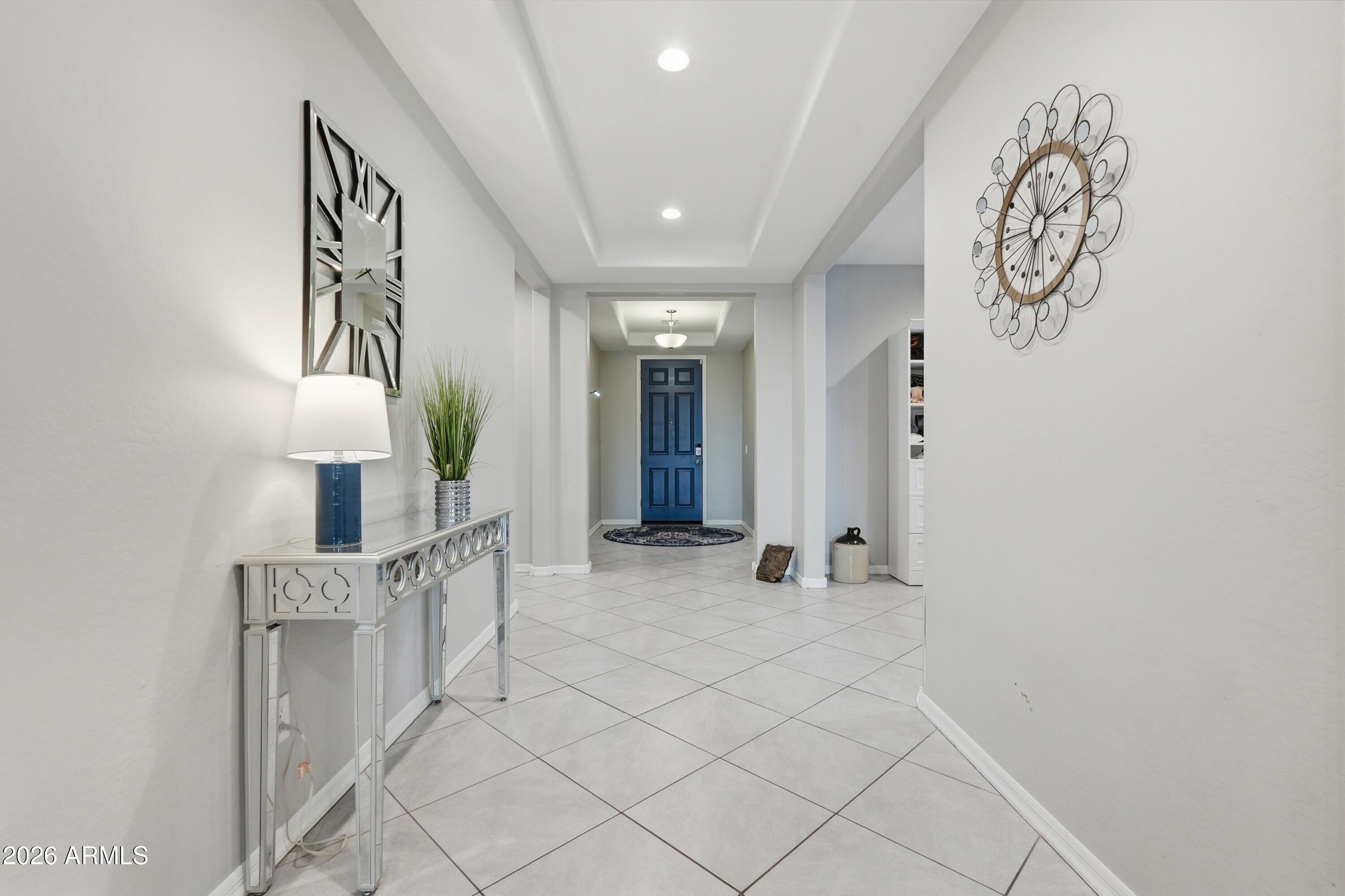 15727 West Madison Street Goodyear, AZ 85338 - Photo 6 of 41 a view of entryway with stairs and wooden floor