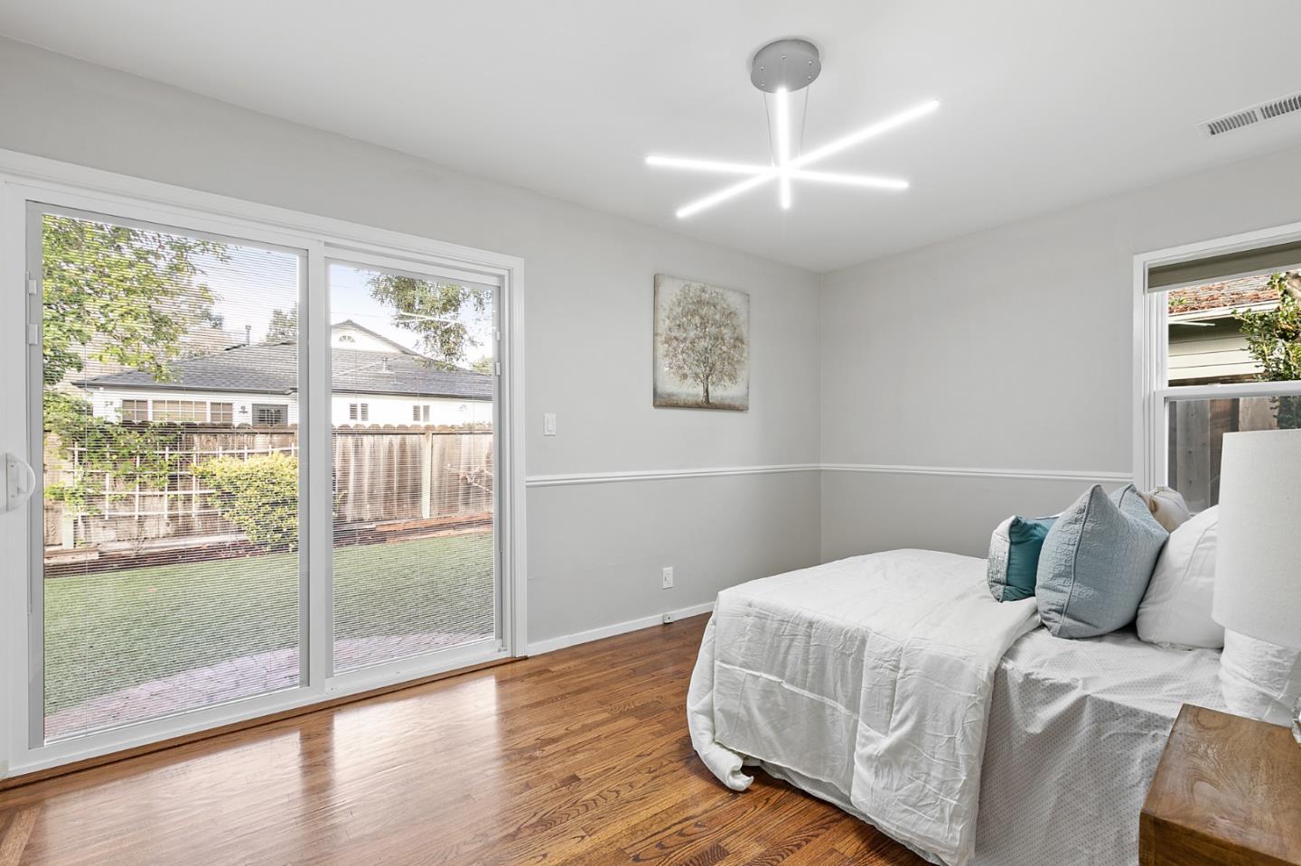 117 Hedge Road Menlo Park, CA 94025 - Photo 13 of 23 a bedroom with a balcony and wooden floor