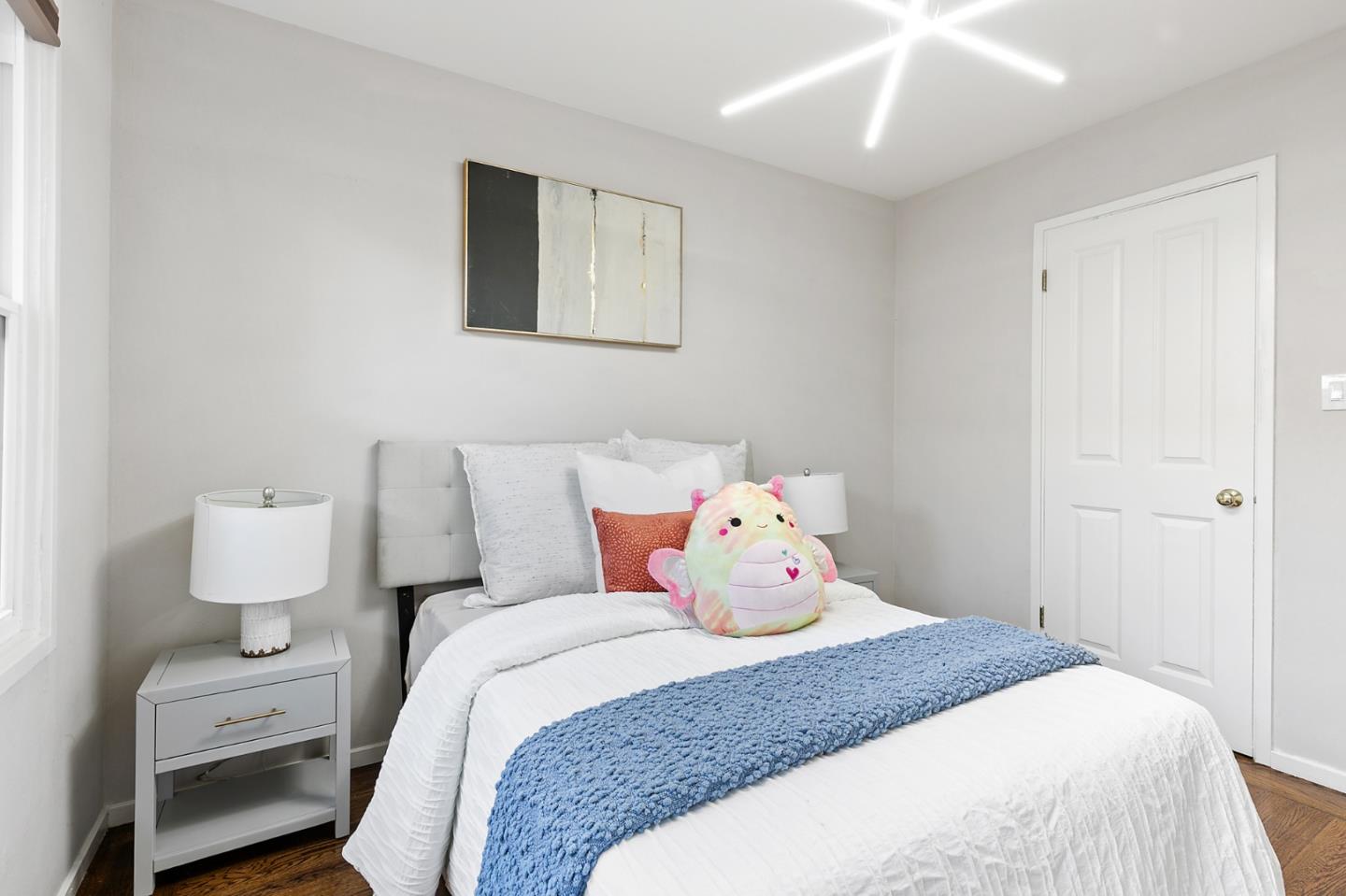 117 Hedge Road Menlo Park, CA 94025 - Photo 16 of 23 a bedroom with bed and wooden floor