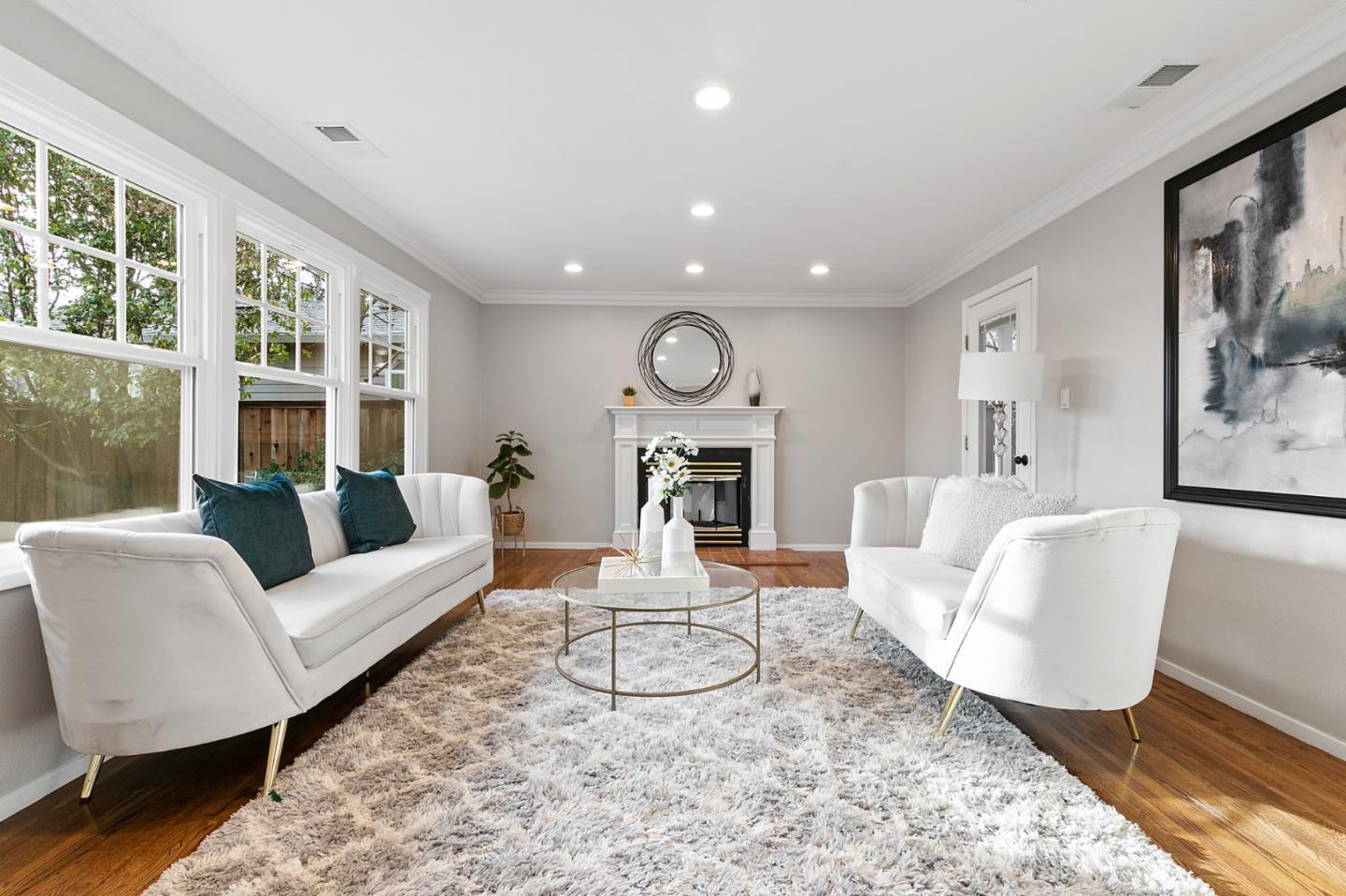 117 Hedge Road Menlo Park, CA 94025 - Photo 4 of 23 a living room with furniture a large window and wooden floor
