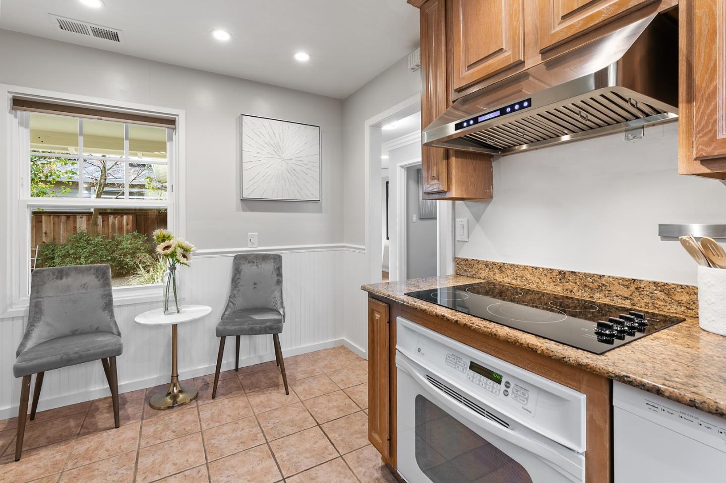 117 Hedge Road Menlo Park, CA 94025 - Photo 10 of 23 a kitchen with a stove cabinets and a stove top oven