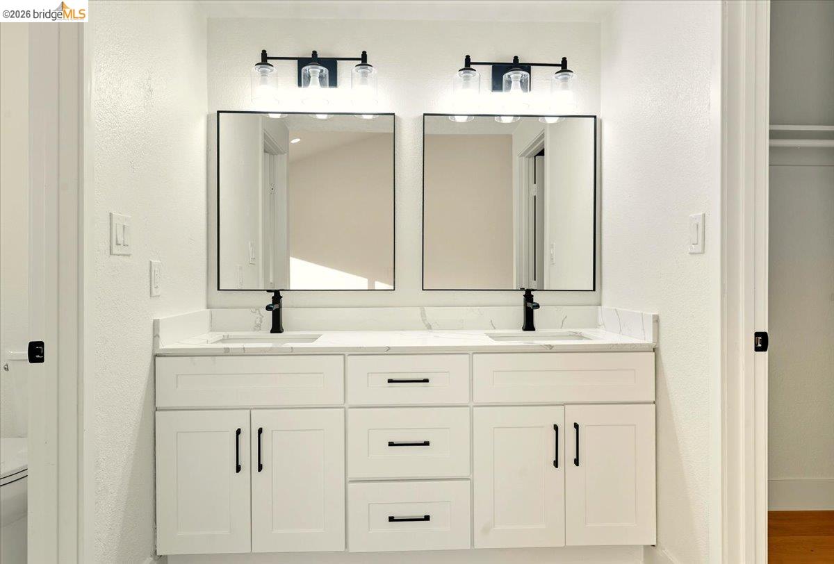 11 Paddock Court Pleasant Hill, CA 94523 - Photo 18 of 34 a bathroom with double sink and a mirror