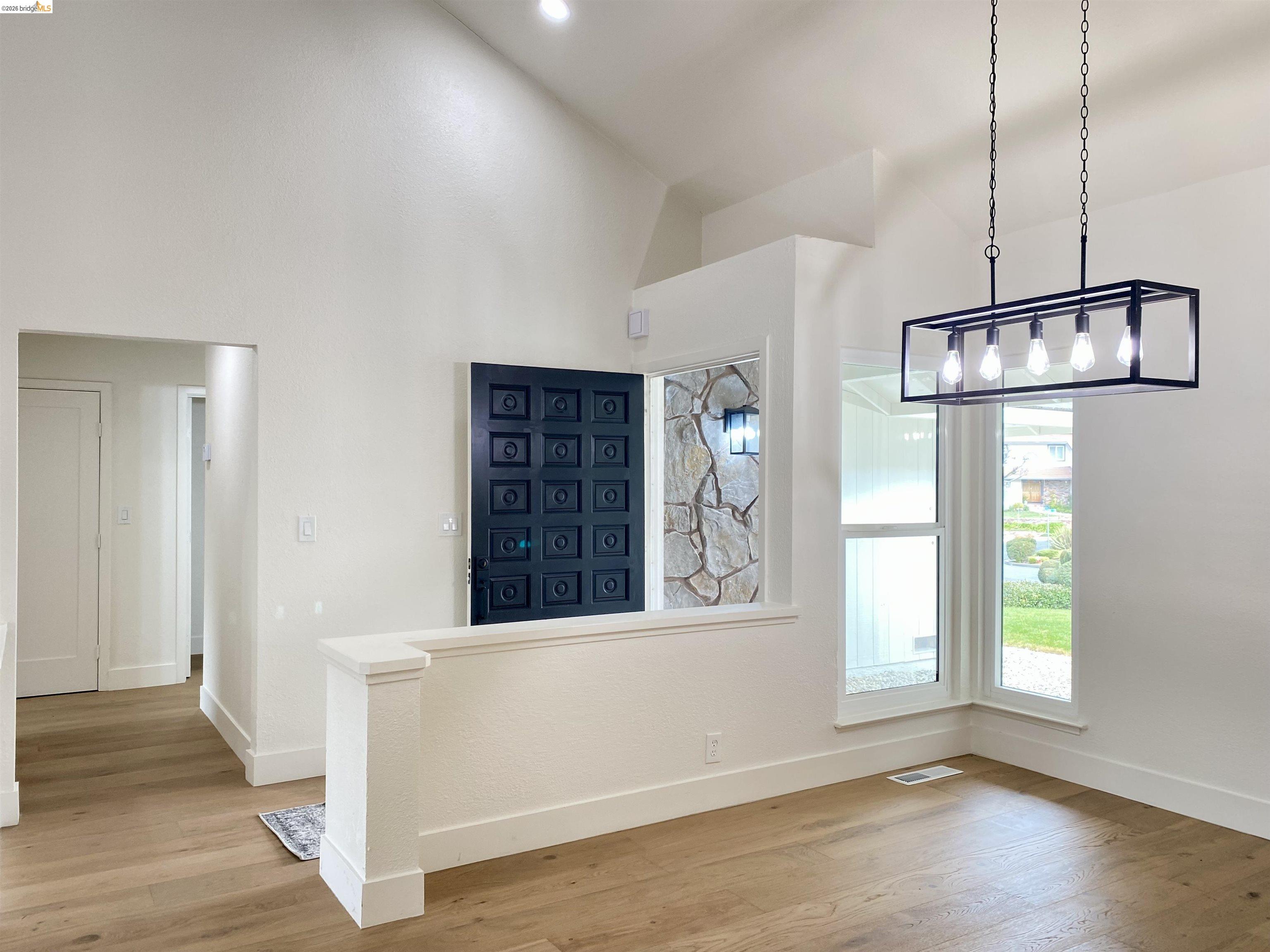 11 Paddock Court Pleasant Hill, CA 94523 - Photo 29 of 34 Unfurnished dining area featuring light wood finished floors and a high ceiling