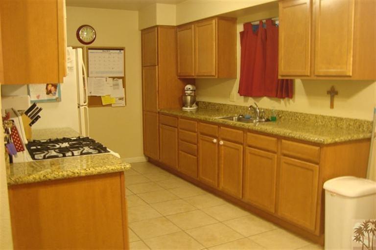 82376 Adobe Road Indio, CA 92201 - Photo 2 of 7 a kitchen with a stove and a sink