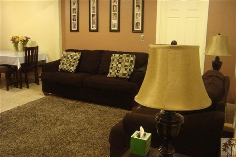 82376 Adobe Road Indio, CA 92201 - Photo 4 of 7 a living room with furniture and a lamp