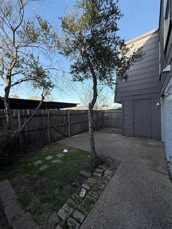 a backyard of a house with lots of green space