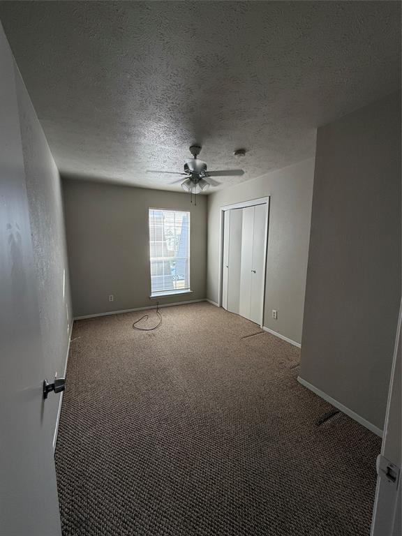 3629 Rickshaw Drive, Unit 3633 Dallas, TX 75229 - Photo 4 of 12 a view of an empty room with a window