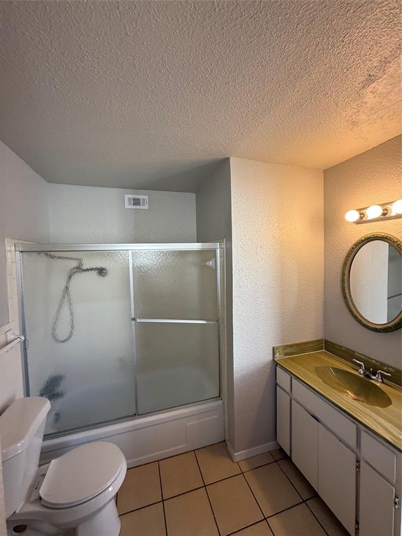 3629 Rickshaw Drive, Unit 3633 Dallas, TX 75229 - Photo 8 of 12 a bathroom with a granite countertop sink toilet and shower
