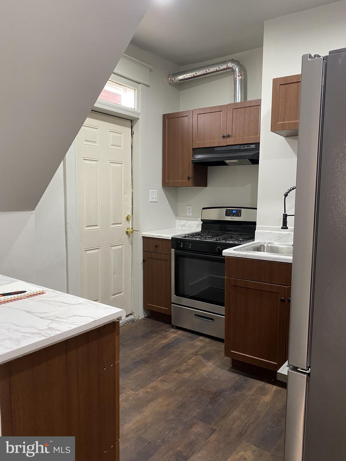 508 South Prince Street Lancaster, PA 17603 - Photo 19 of 21 a kitchen with stainless steel appliances a stove a refrigerator and a sink