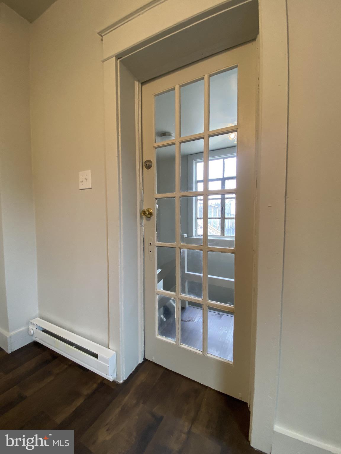 508 South Prince Street Lancaster, PA 17603 - Photo 4 of 21 a view of an empty room with wooden floor and a window