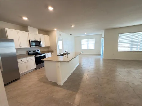 a large kitchen with cabinets