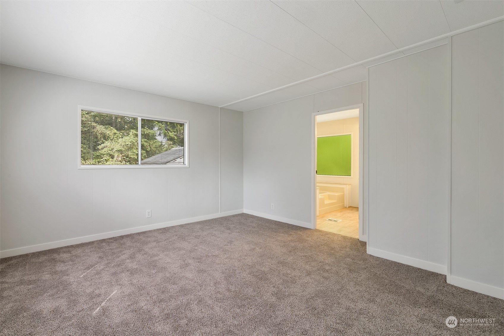 1121 244th Street Southwest, Unit 1 Bothell, WA 98021 - Photo 14 of 25 an empty room with a window