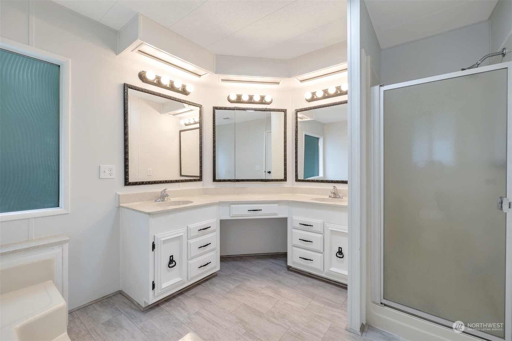 1121 244th Street Southwest, Unit 1 Bothell, WA 98021 - Photo 16 of 25 a spacious bathroom with a double vanity sink and a mirror