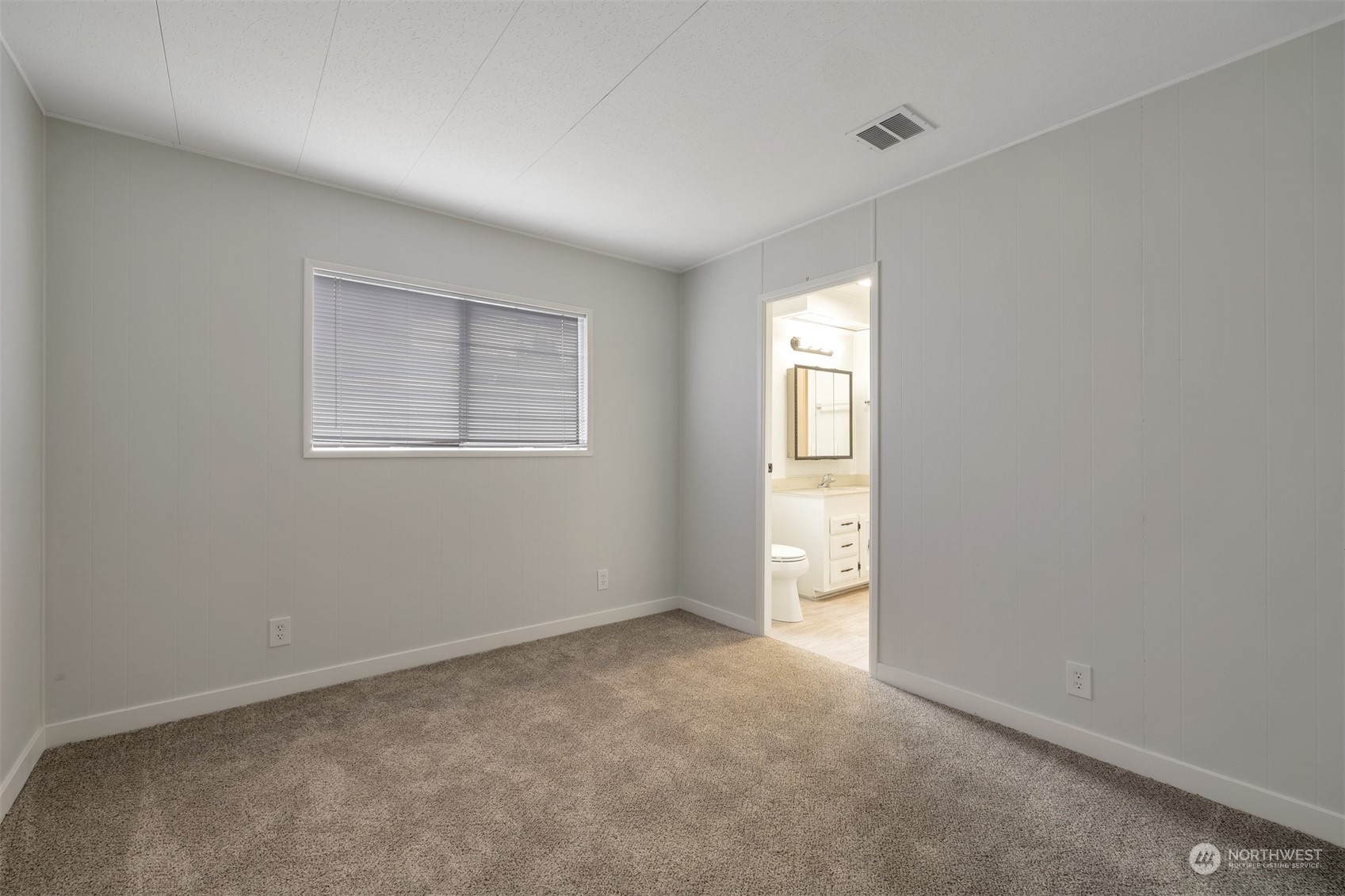 1121 244th Street Southwest, Unit 1 Bothell, WA 98021 - Photo 17 of 25 an empty room with windows and closet