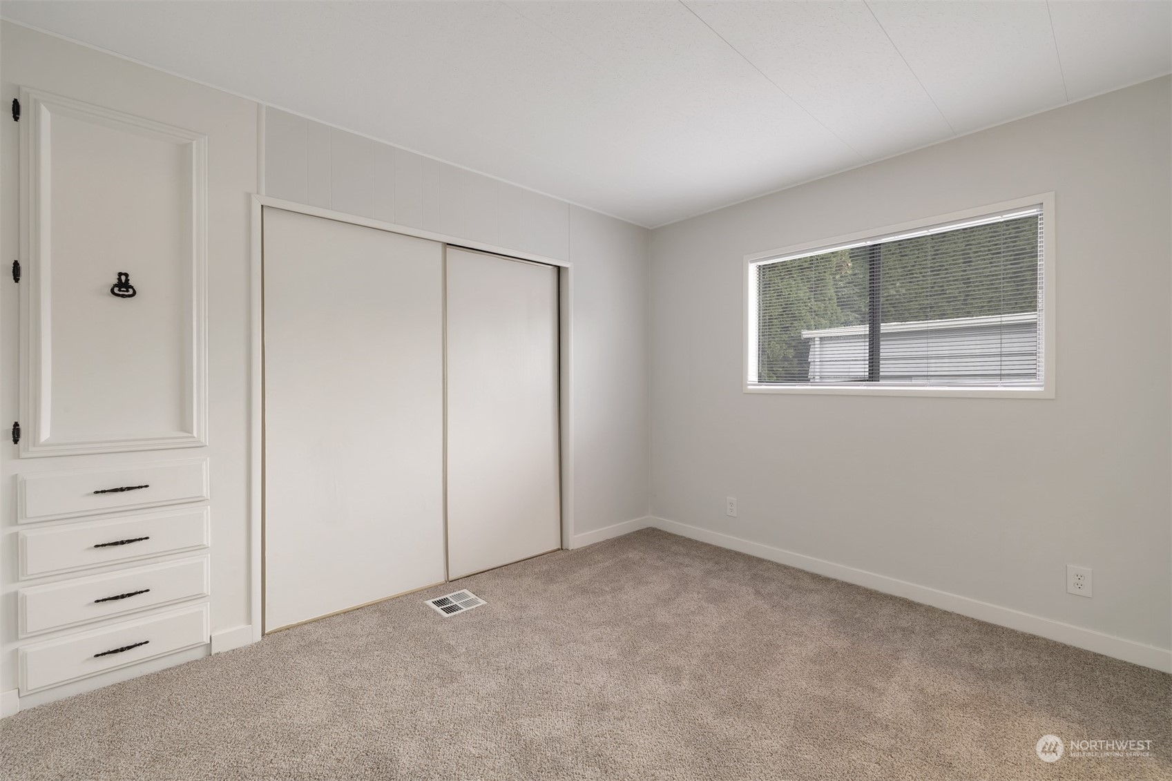 1121 244th Street Southwest, Unit 1 Bothell, WA 98021 - Photo 18 of 25 a view of an empty room with a window
