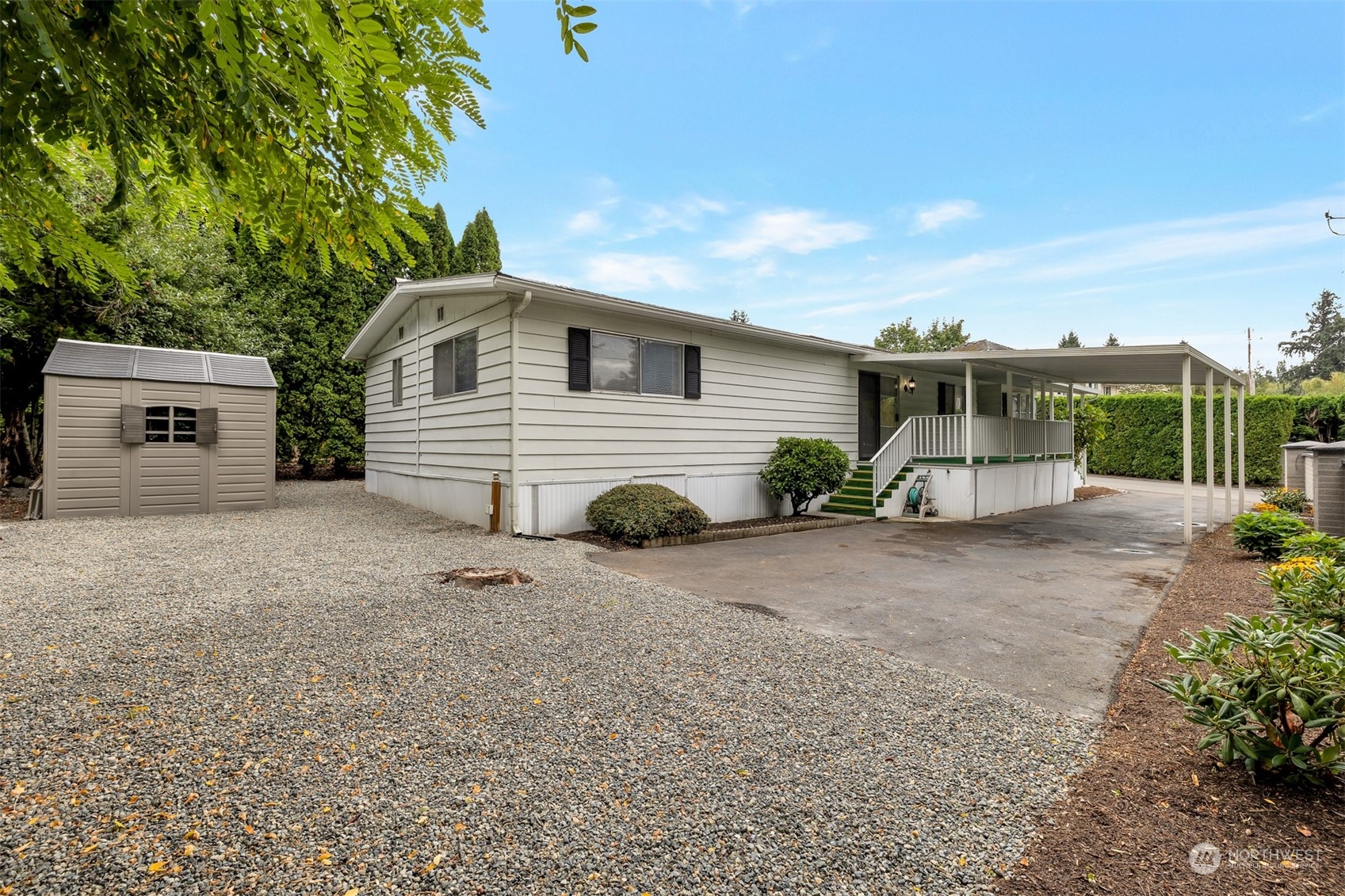 1121 244th Street Southwest, Unit 1 Bothell, WA 98021 - Photo 2 of 25 a view of a house with backyard and garage