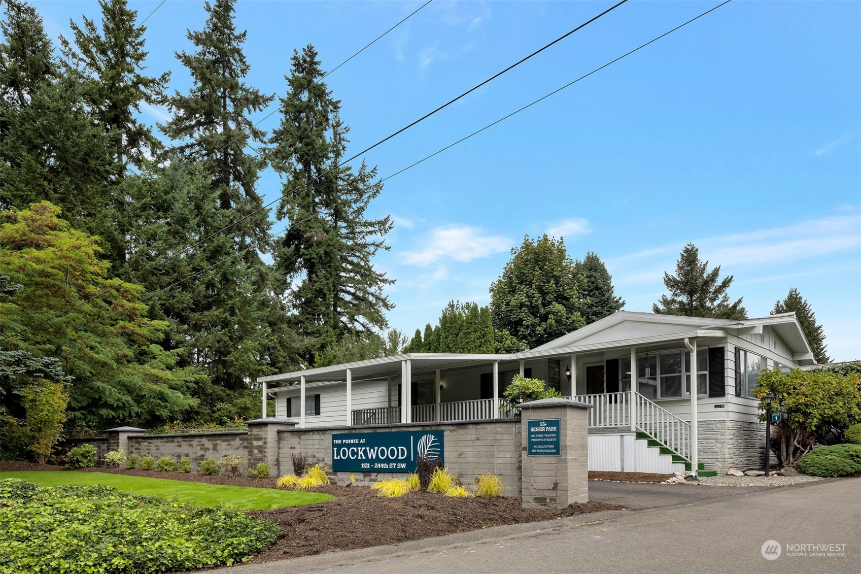 1121 244th Street Southwest, Unit 1 Bothell, WA 98021 - Photo 3 of 25 a front view of a house with a yard